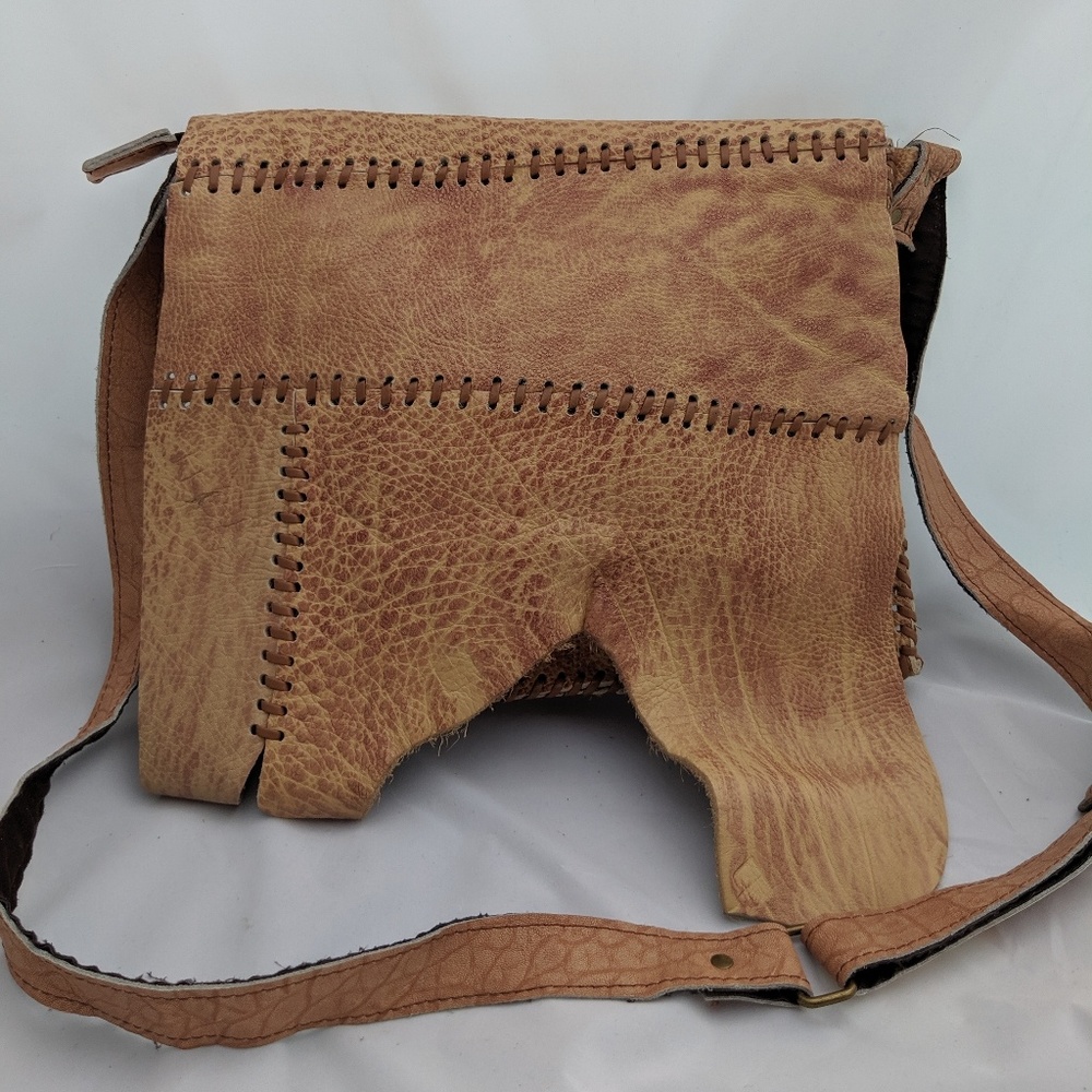 Raw leather mesanger bag.